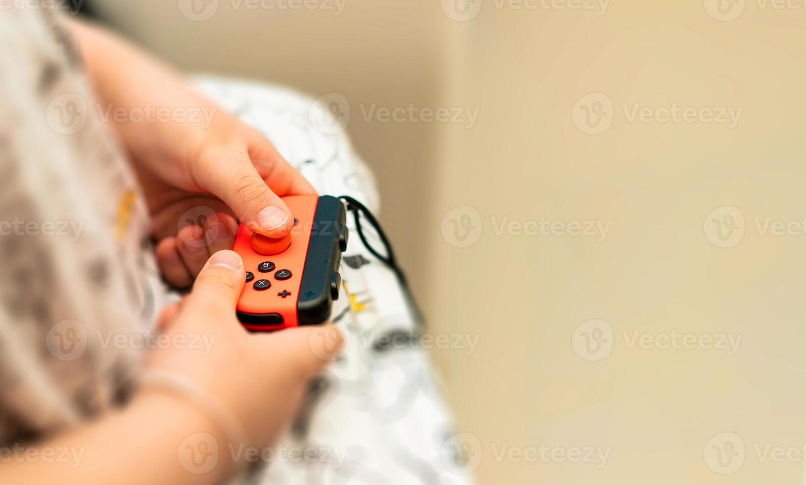 kid play game joystick photo