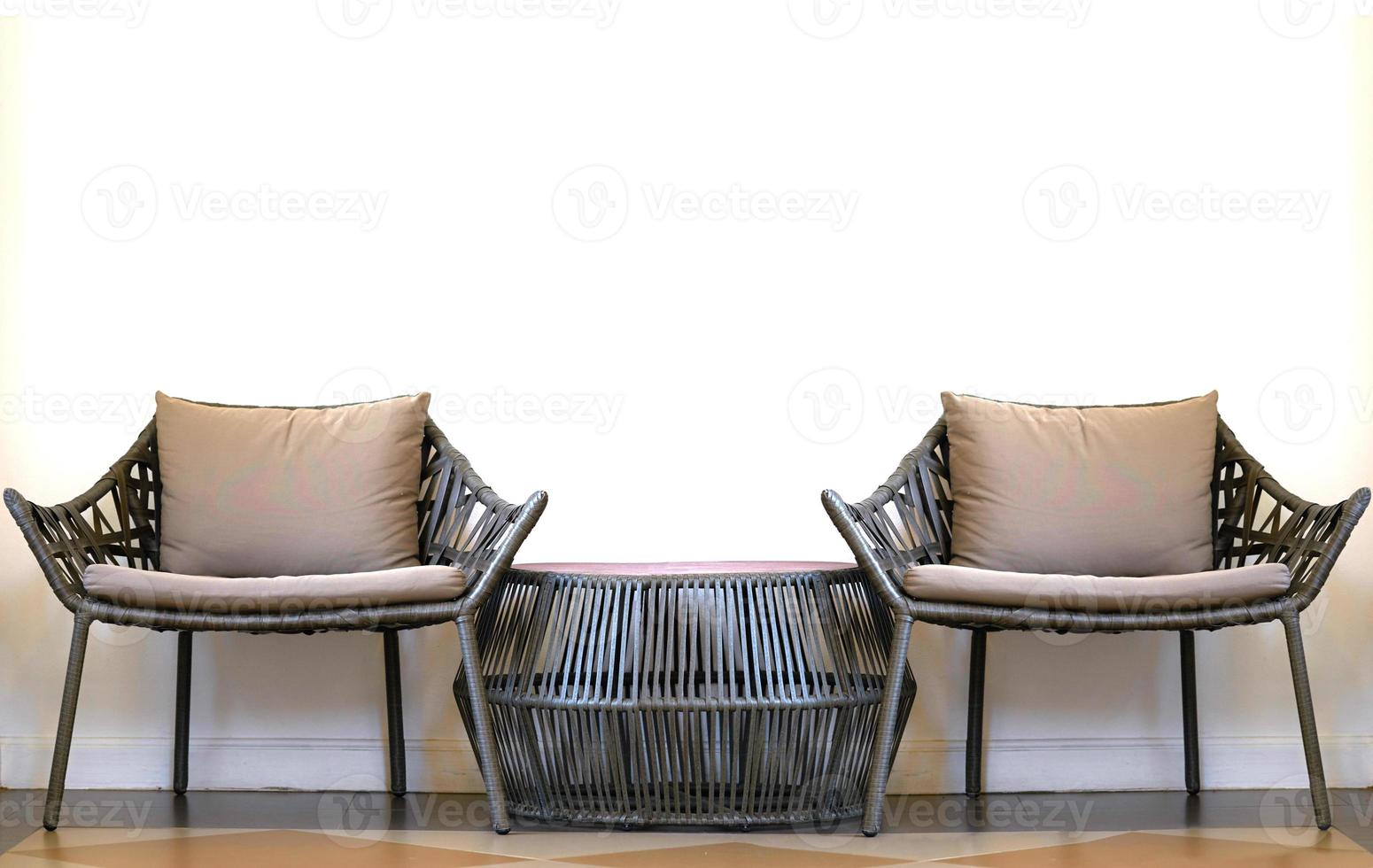 Sofa set of bamboo chairs and short table on floor in comfortable rest concept photo