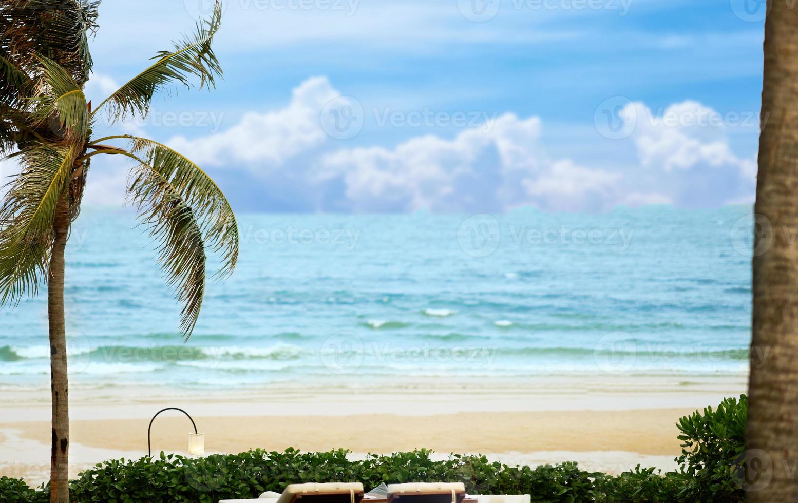 beach front with shade and closed umbrella and sand,no person photo