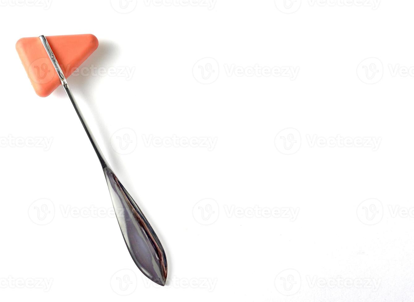 Hammer jerk for doctor uses neuro exam on white background,portrait orientation photo