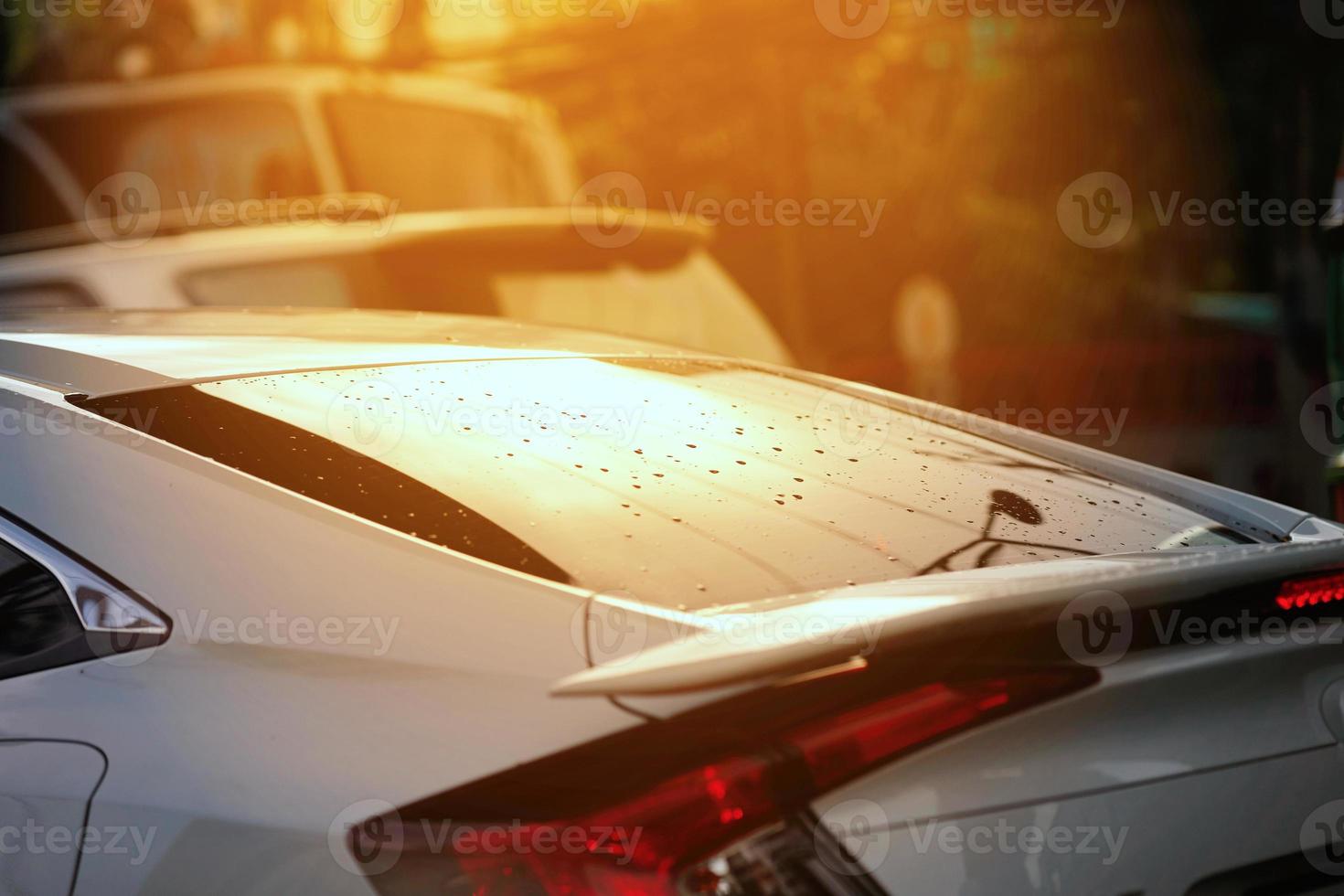 Rear mirror shield of car with reflection of sun light photo