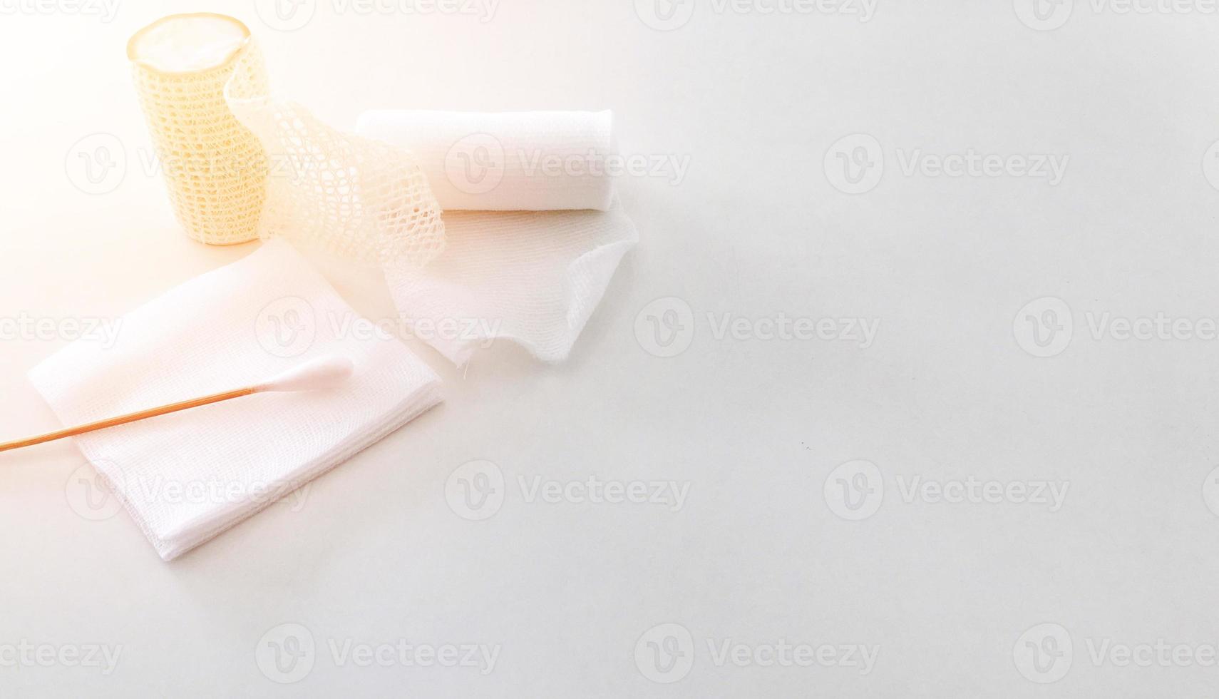 swab ,gauaze ,roll bandage and net bandage with copy space in medical concept photo