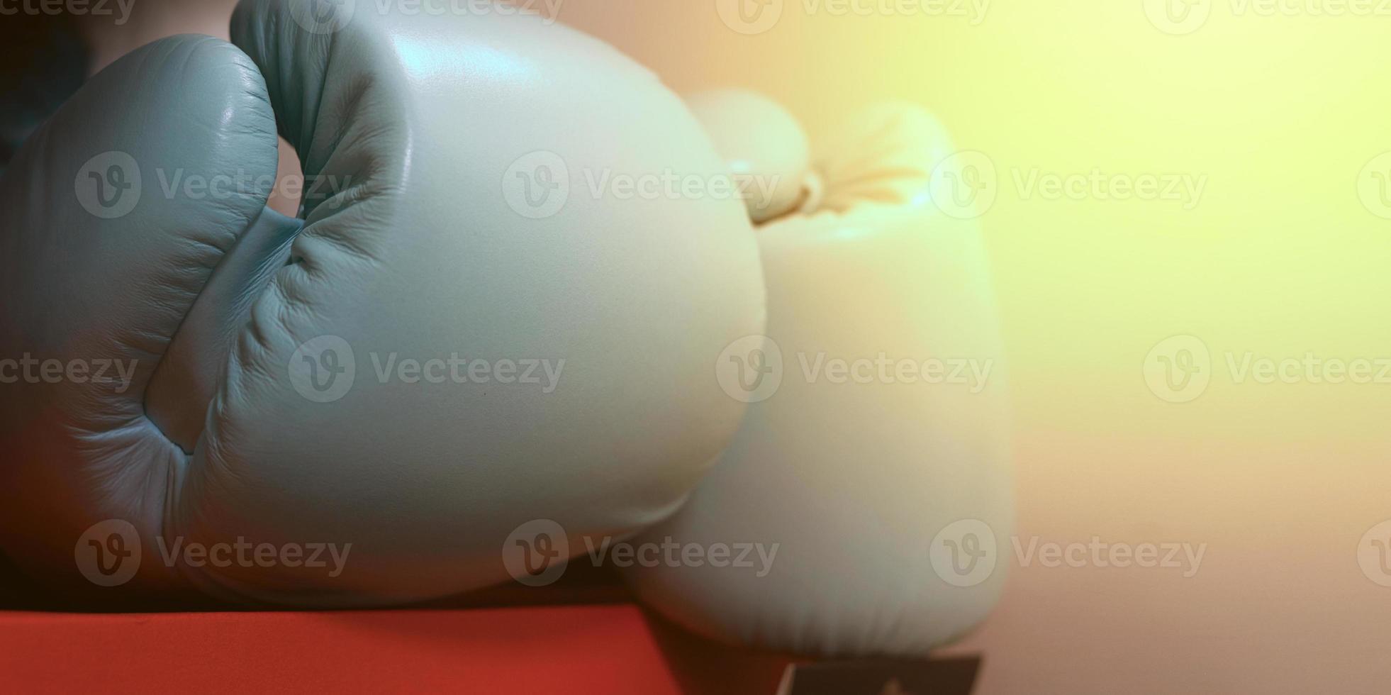 boxing glove on orange box with flare photo