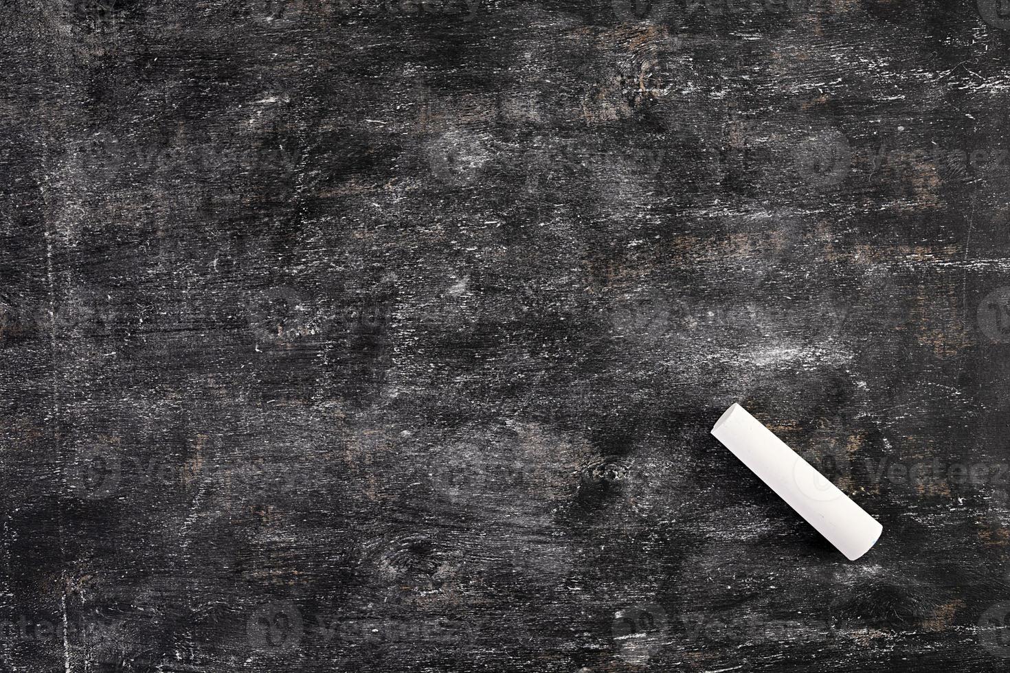 Background of dirty chalkboard. Empty school blackboard. photo