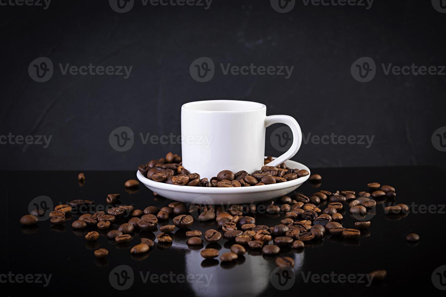 Cup of coffee espresso. Hot drink coffee on dark background photo