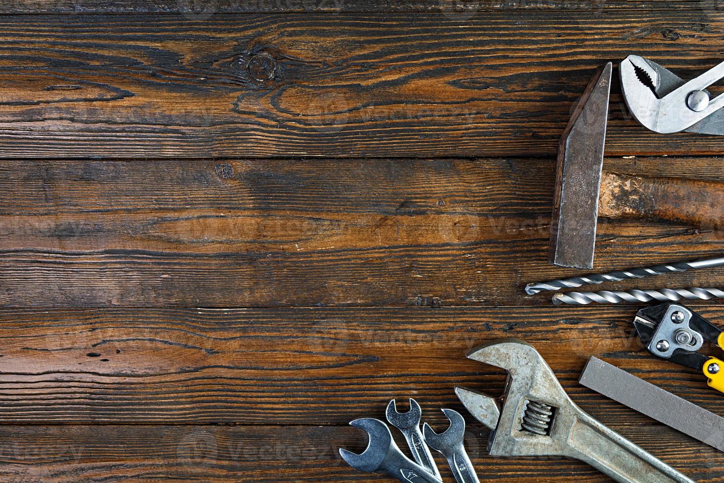 Set of working tools on wooden rustic background. Top view. Copy space photo