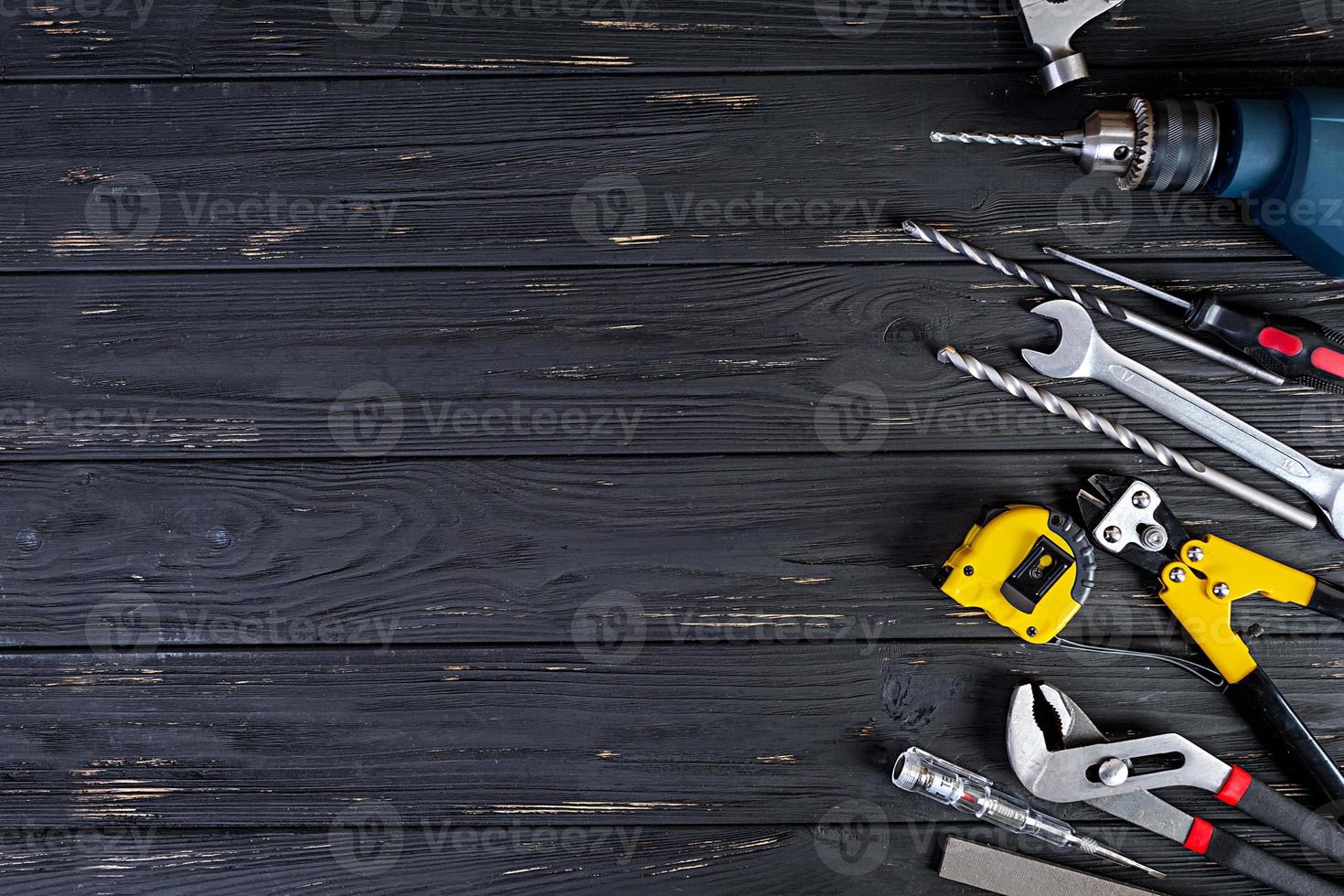 Set of working tools on wooden rustic background. Top view. Copy space photo