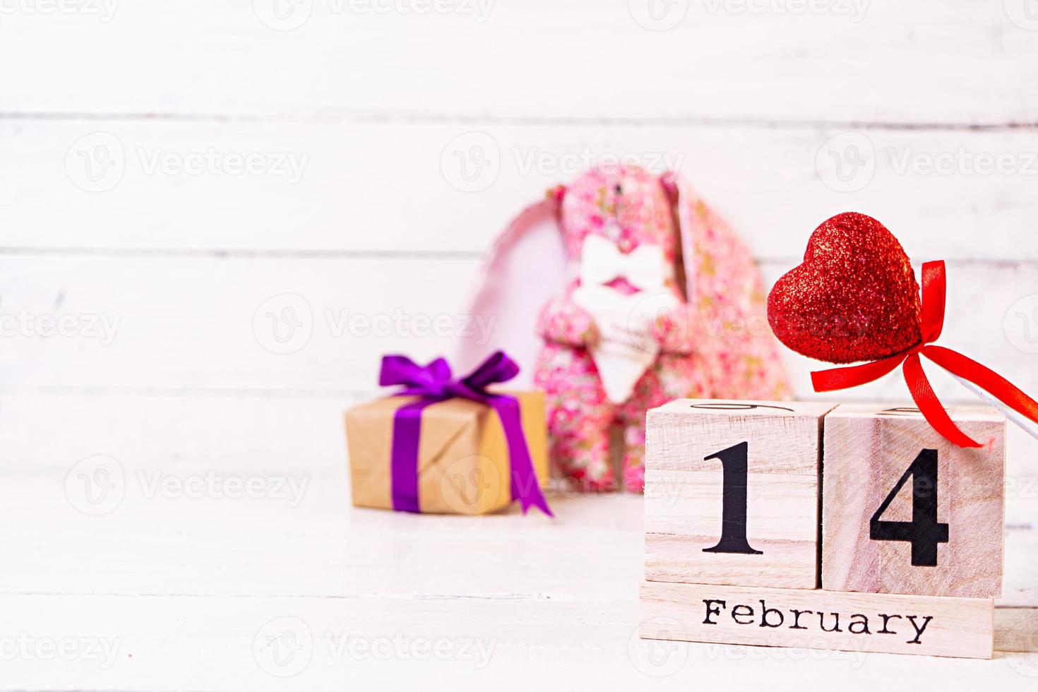 Valentine day. Wooden calendar with February 14 on it. photo