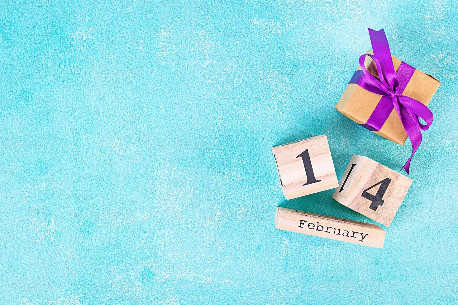 Valentine day. Wooden calendar with February 14 on it. photo