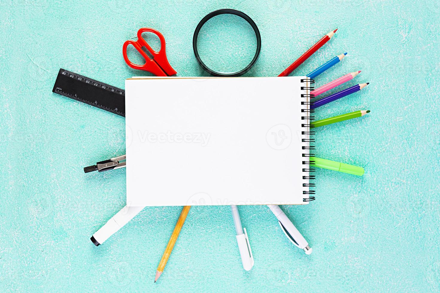 Concept back to school. Different supplies for sketch. School accessories. photo