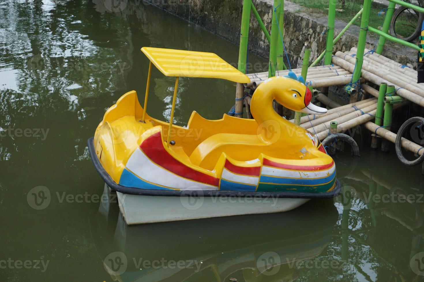 A UNIQUE DUCK DUCK BOAT TOY, YELLOW COLOR photo