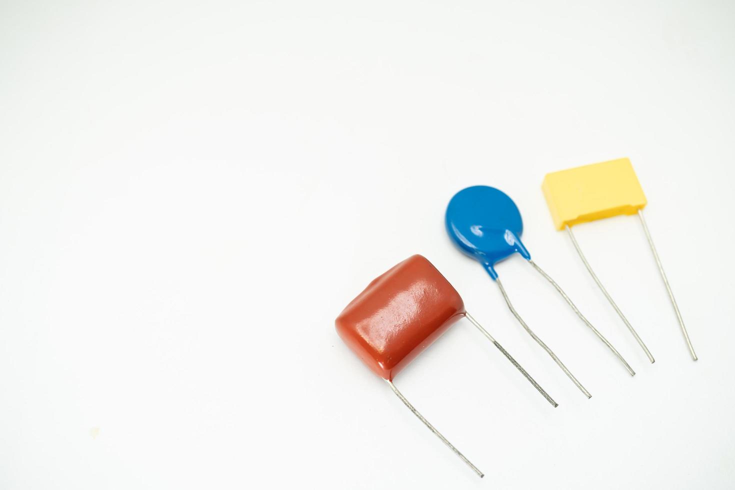 Isolated group of capacitor, used in electronic device. Electronic parts concept. photo