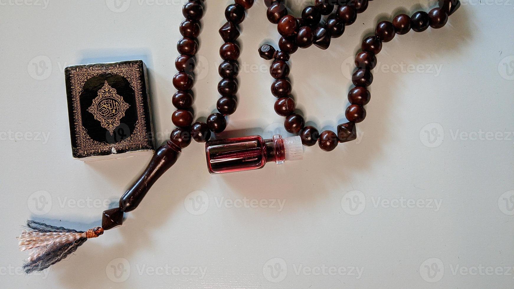 Islamic background of prayer and worship equipment. The text in the photo is in Arabic which means the Qur'an.