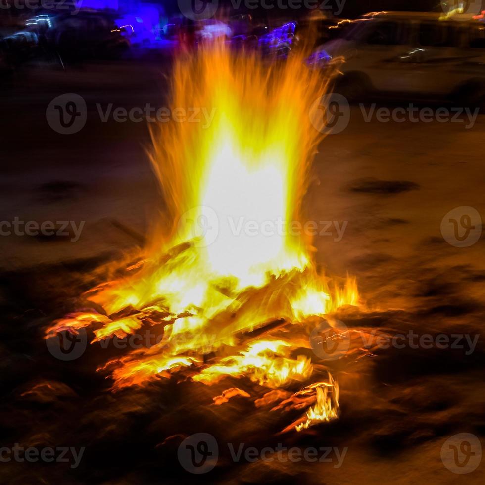 Fire flames on black background, Blaze fire flame texture background, Beautifully, the fire is burning, Fire flames with wood and cow dung bonfire photo