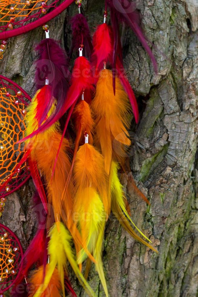 Handmade dream catcher with feathers threads and beads rope hanging photo