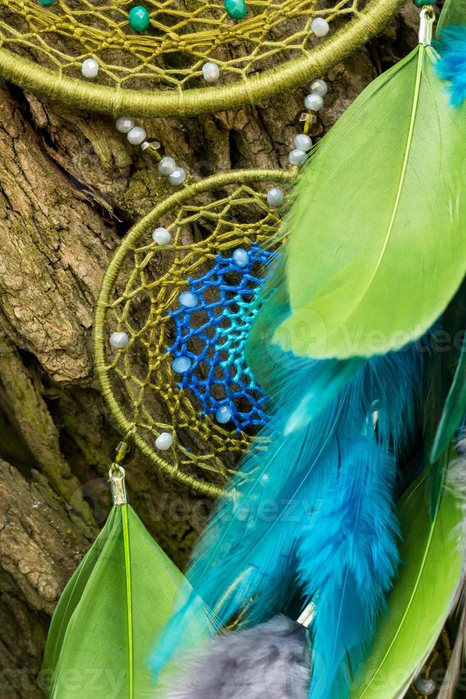 Handmade dream catcher with feathers threads and beads rope hanging photo