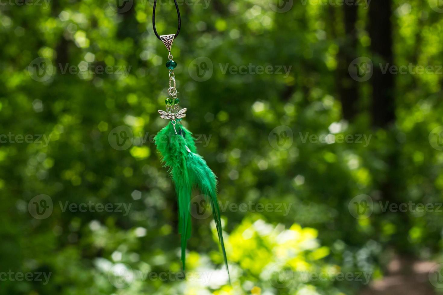 Handmade dream catcher with feathers threads and beads rope hanging photo