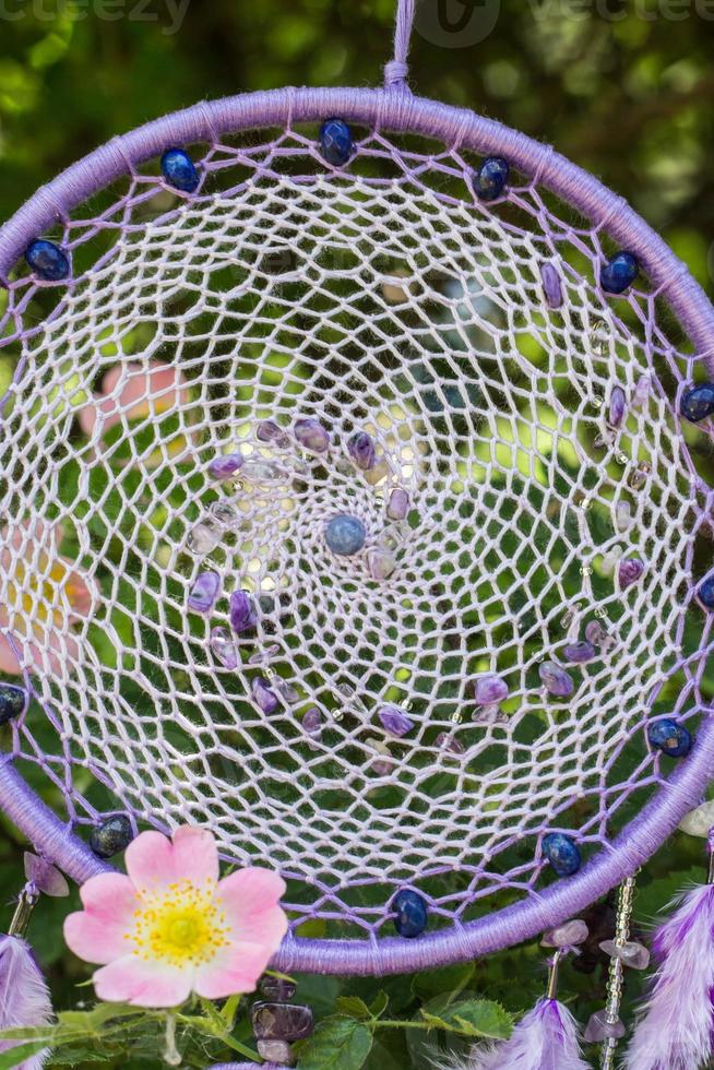 Handmade dream catcher with feathers threads and beads rope hanging photo