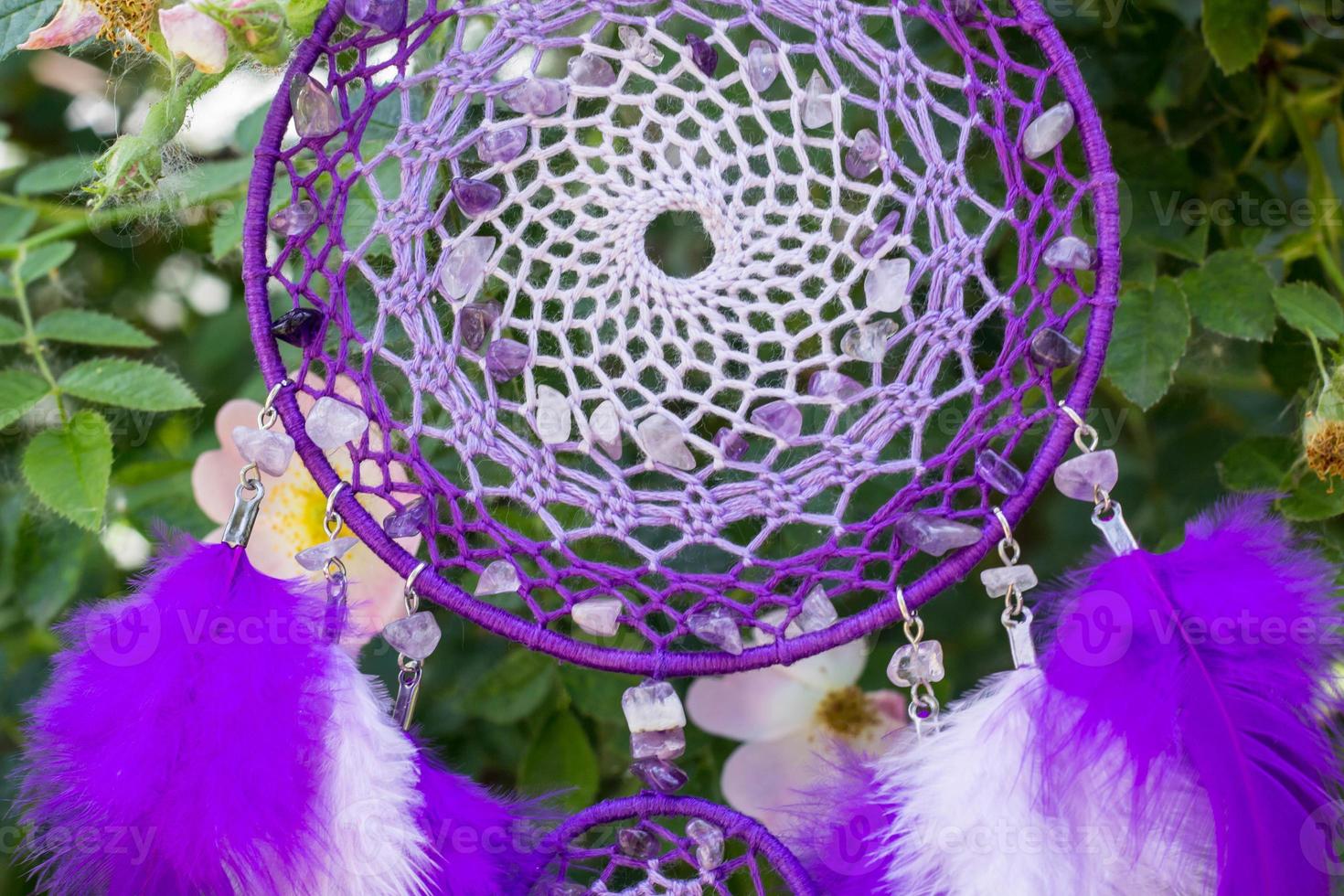 Handmade dream catcher with feathers threads and beads rope hanging photo