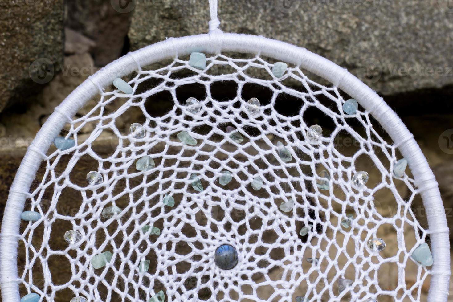 Handmade dream catcher with feathers threads and beads rope hanging photo