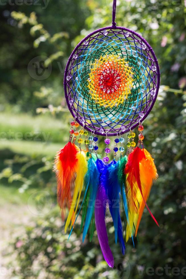 Handmade dream catcher with feathers threads and beads rope hanging photo