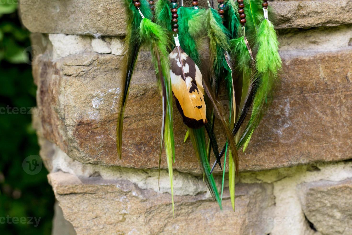 Handmade dream catcher with feathers threads and beads rope hanging photo