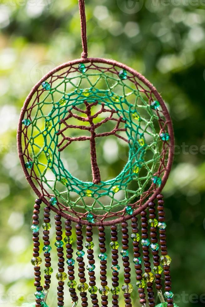 Handmade dream catcher with feathers threads and beads rope hanging photo