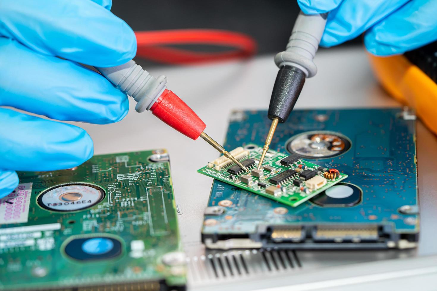 Technician repairing inside of mobile phone by soldering iron. Integrated Circuit. the concept of data, hardware, technology. photo