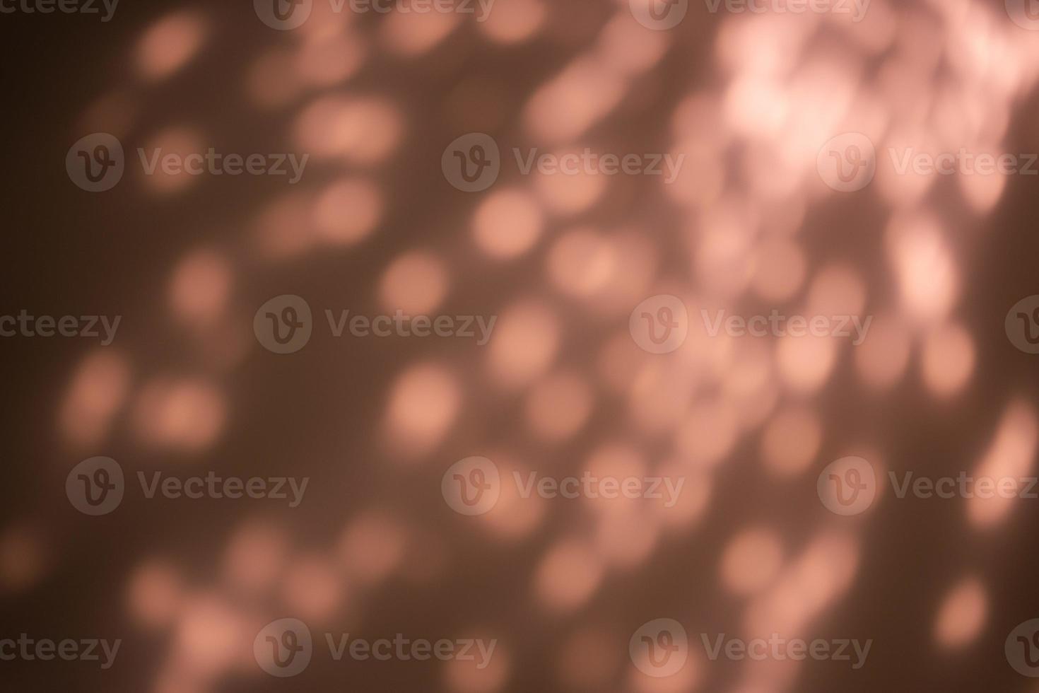 Blurred bokeh Pink rose gold glowing sparkles photo