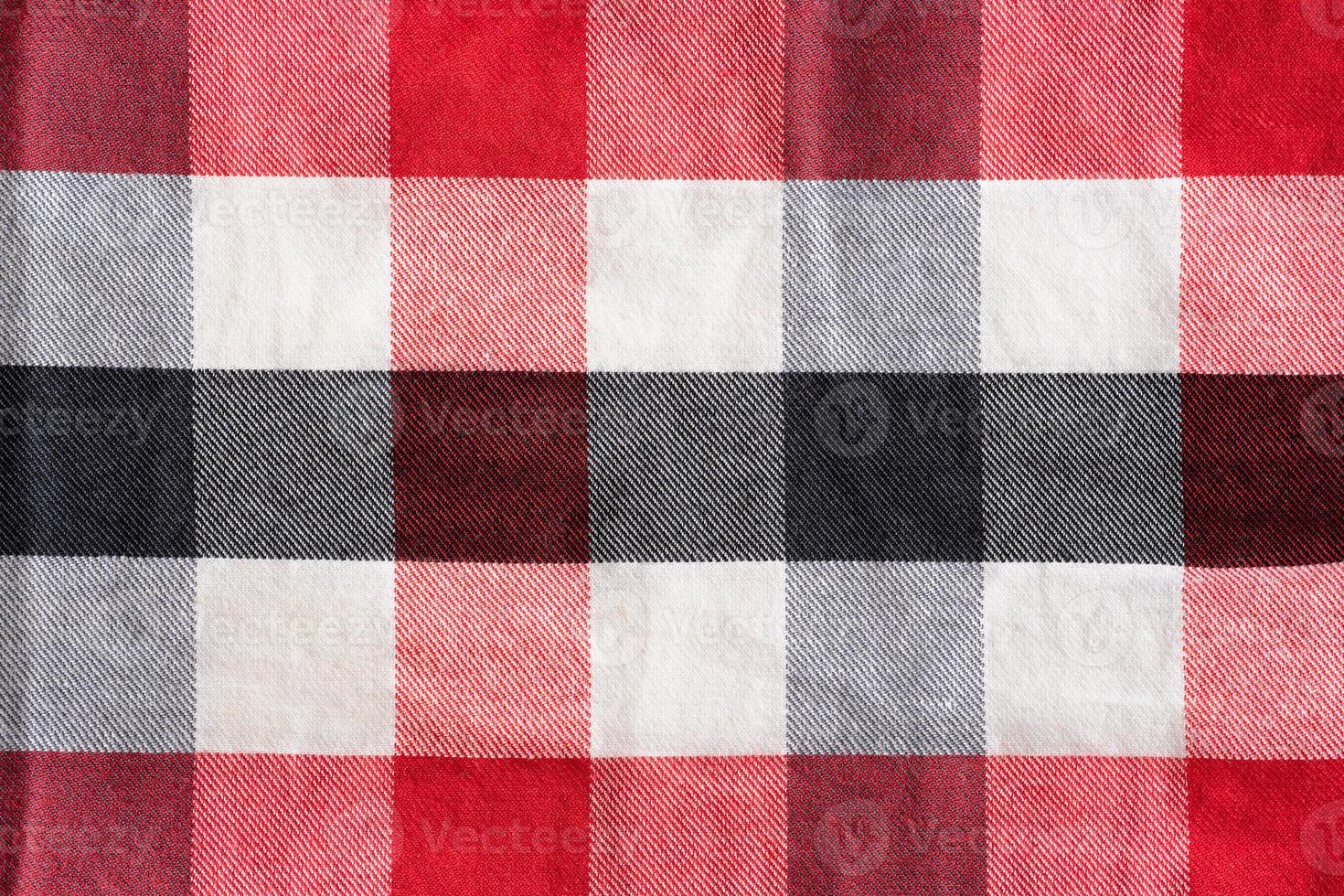 Red black and white checker pattern textile photo