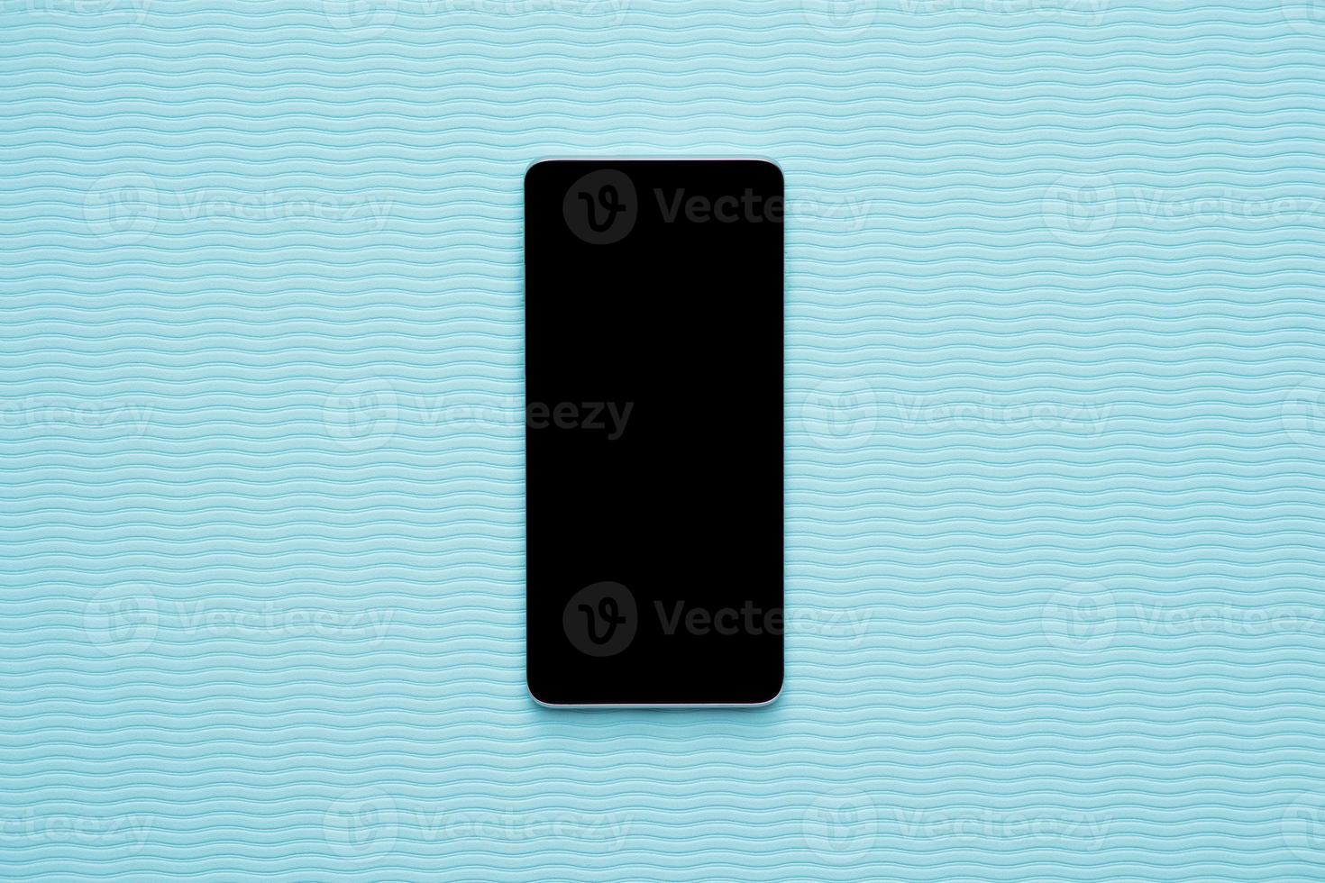 Vertical blank phone on blue wave background photo