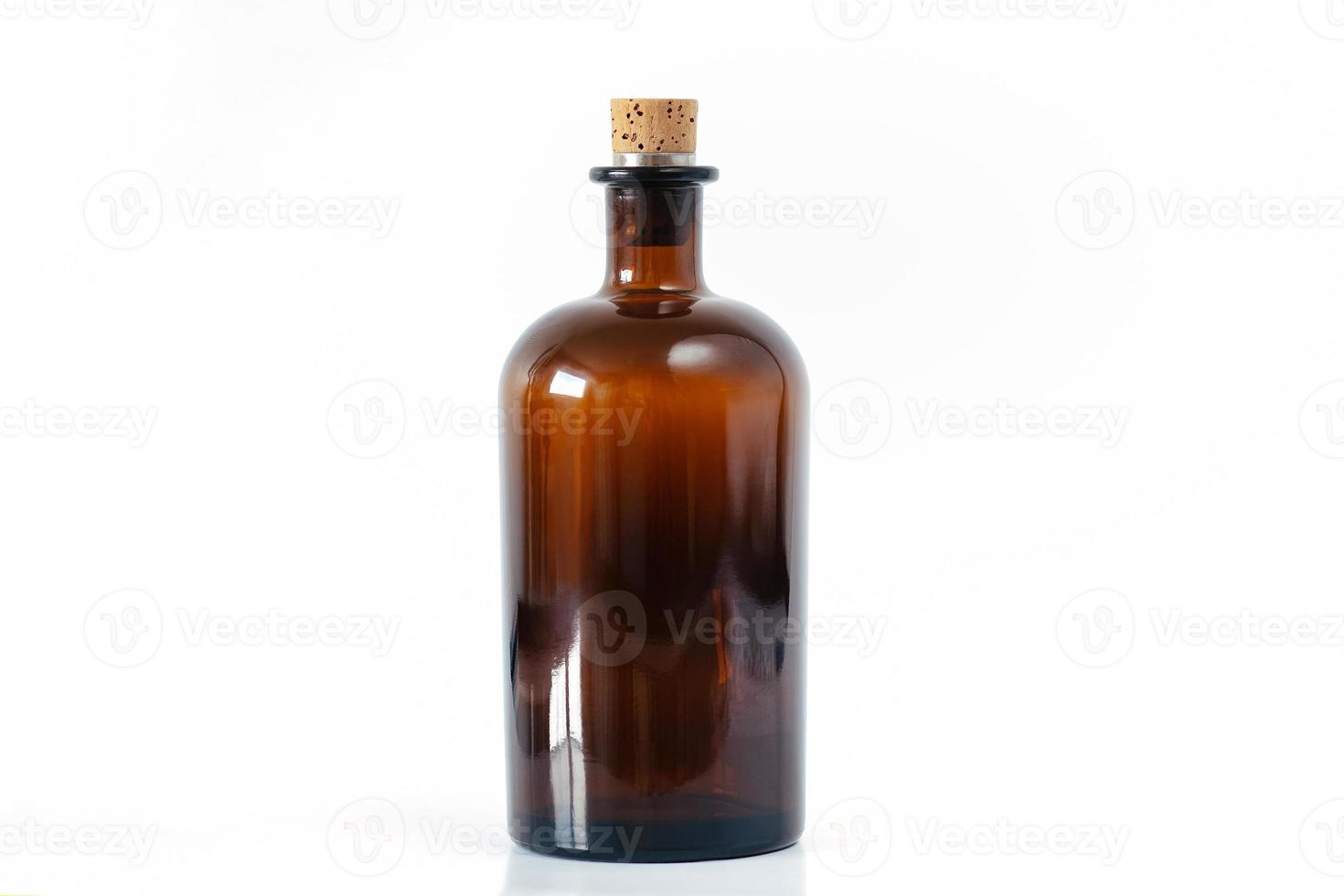 Brown apothecary glass bottle with cork stopper photo