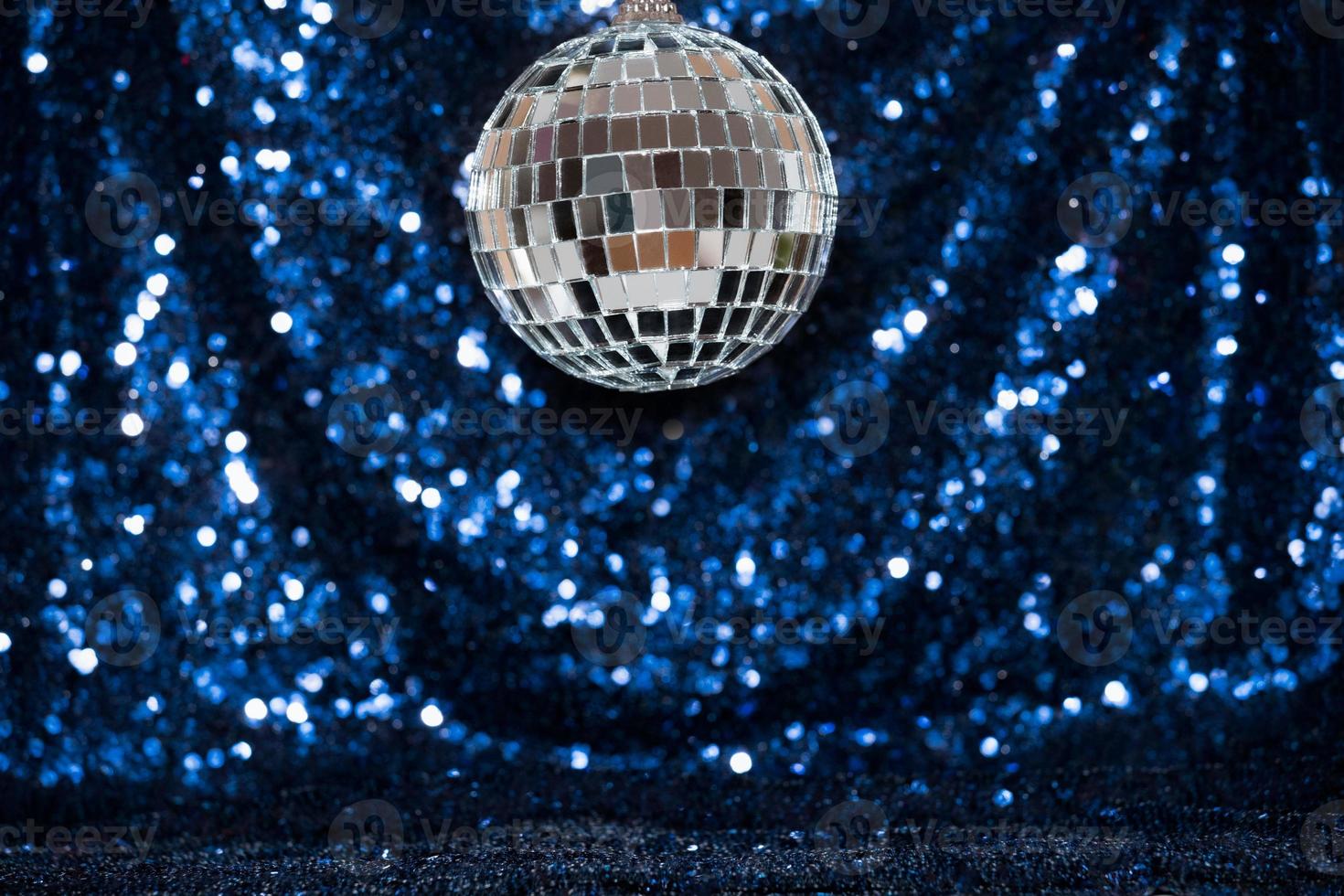 disco ball on sequin background photo