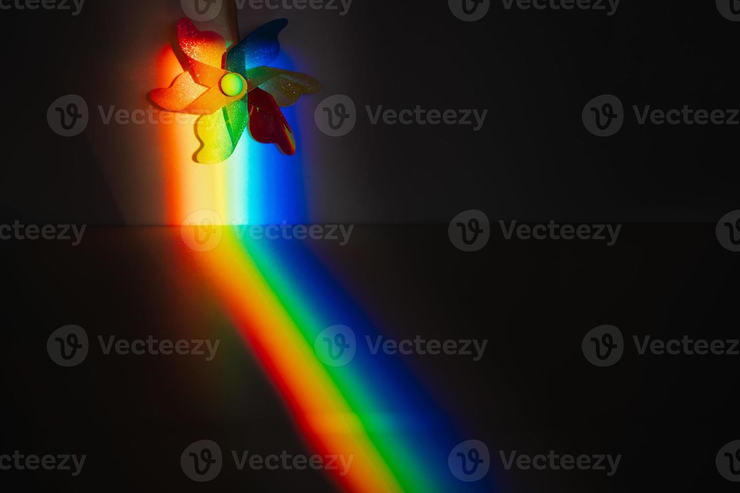 Colorful pinwheel in a rainbow strip photo