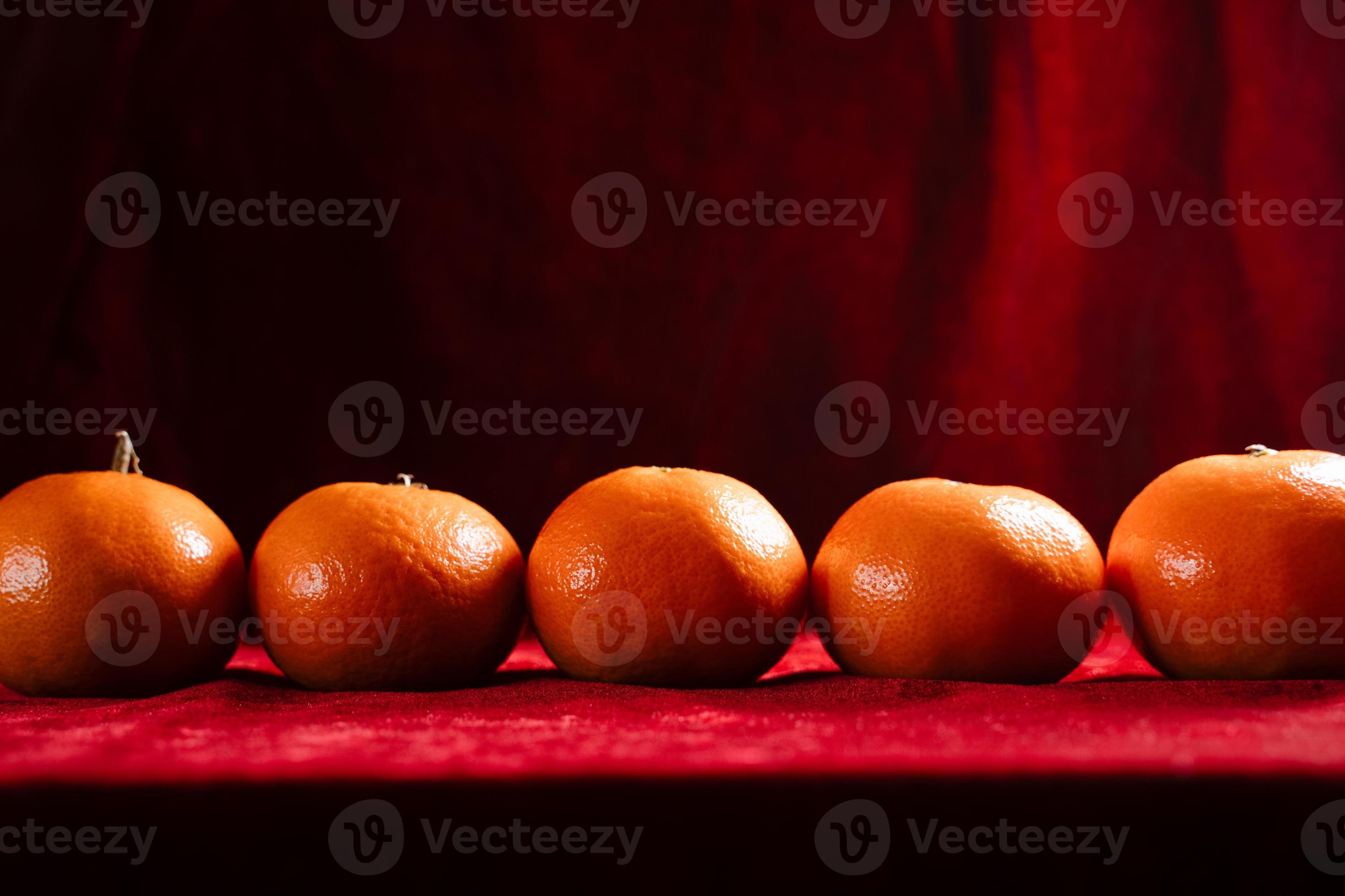 clementines on red background 7150308 Stock Photo at Vecteezy