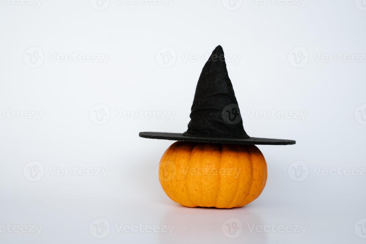 Small pumpkin with witch hat photo