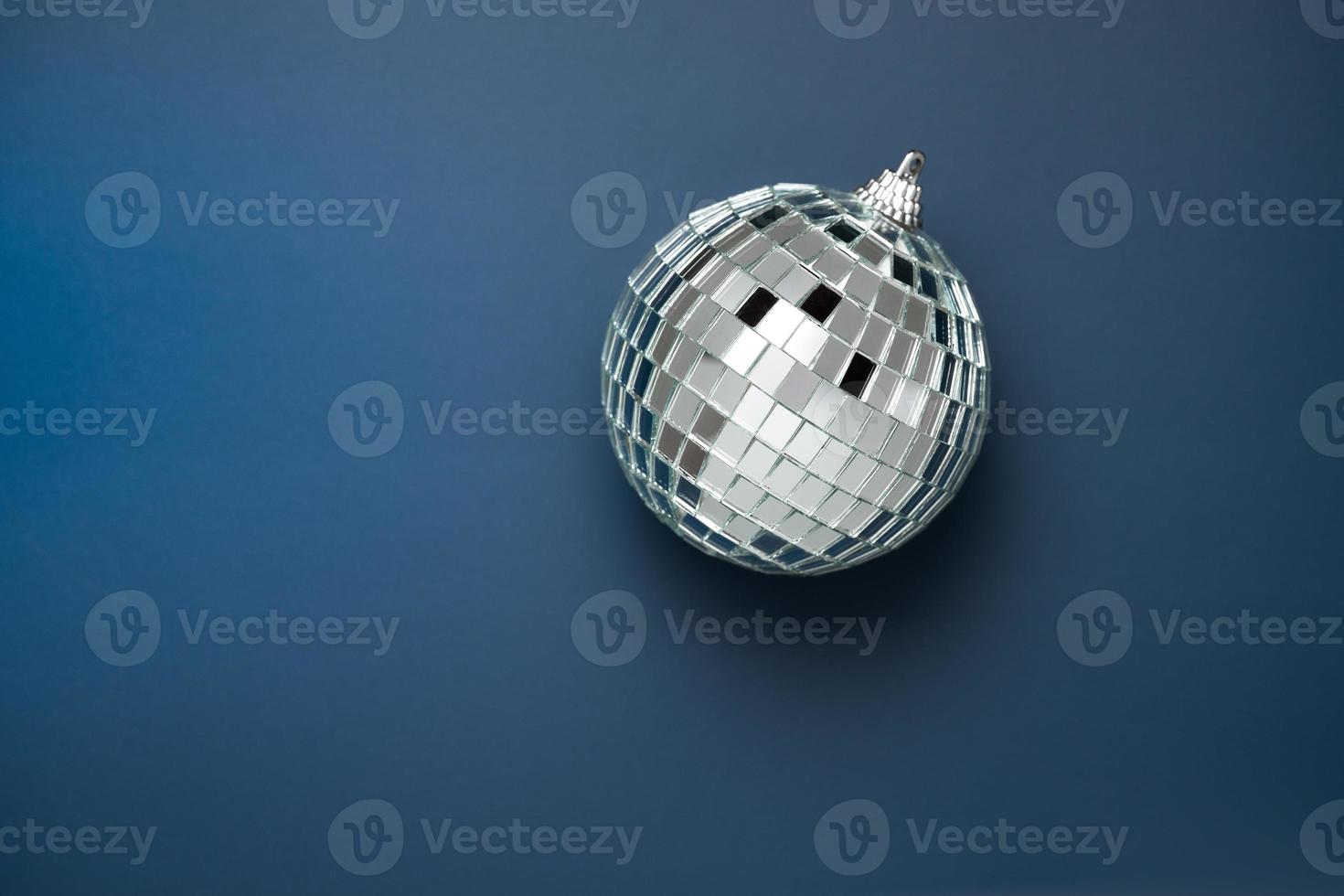 disco ball on dark blue background photo