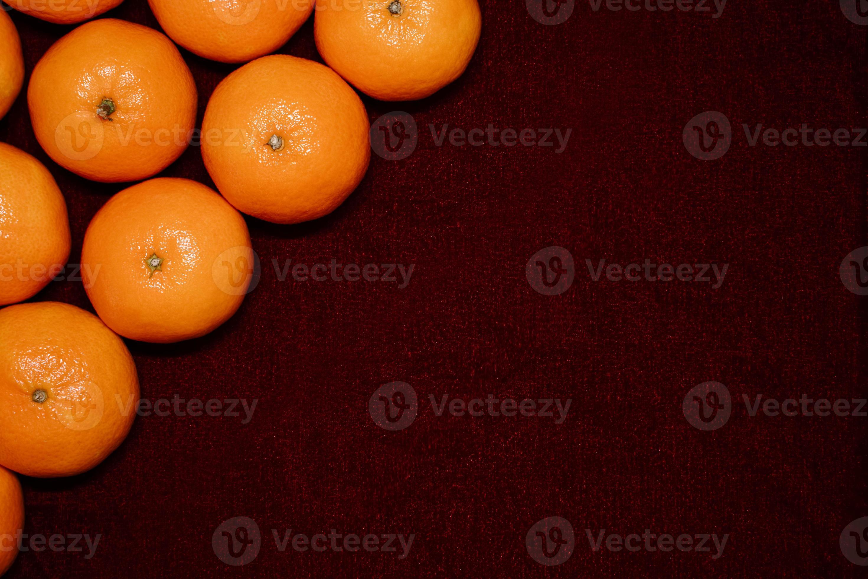 Fresh clementines on red background 7150889 Stock Photo at Vecteezy