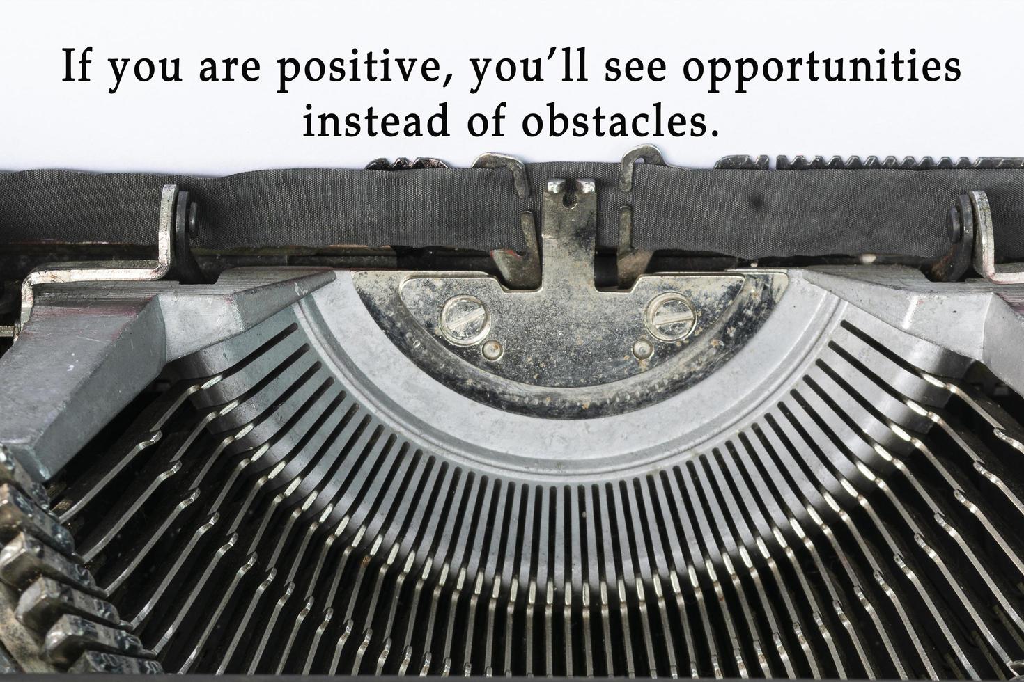 Motivational and inspirational quote typed on an old classic typewriter. photo