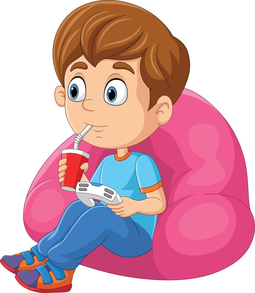 niño pequeño de dibujos animados jugando videojuegos mientras bebe soda vector