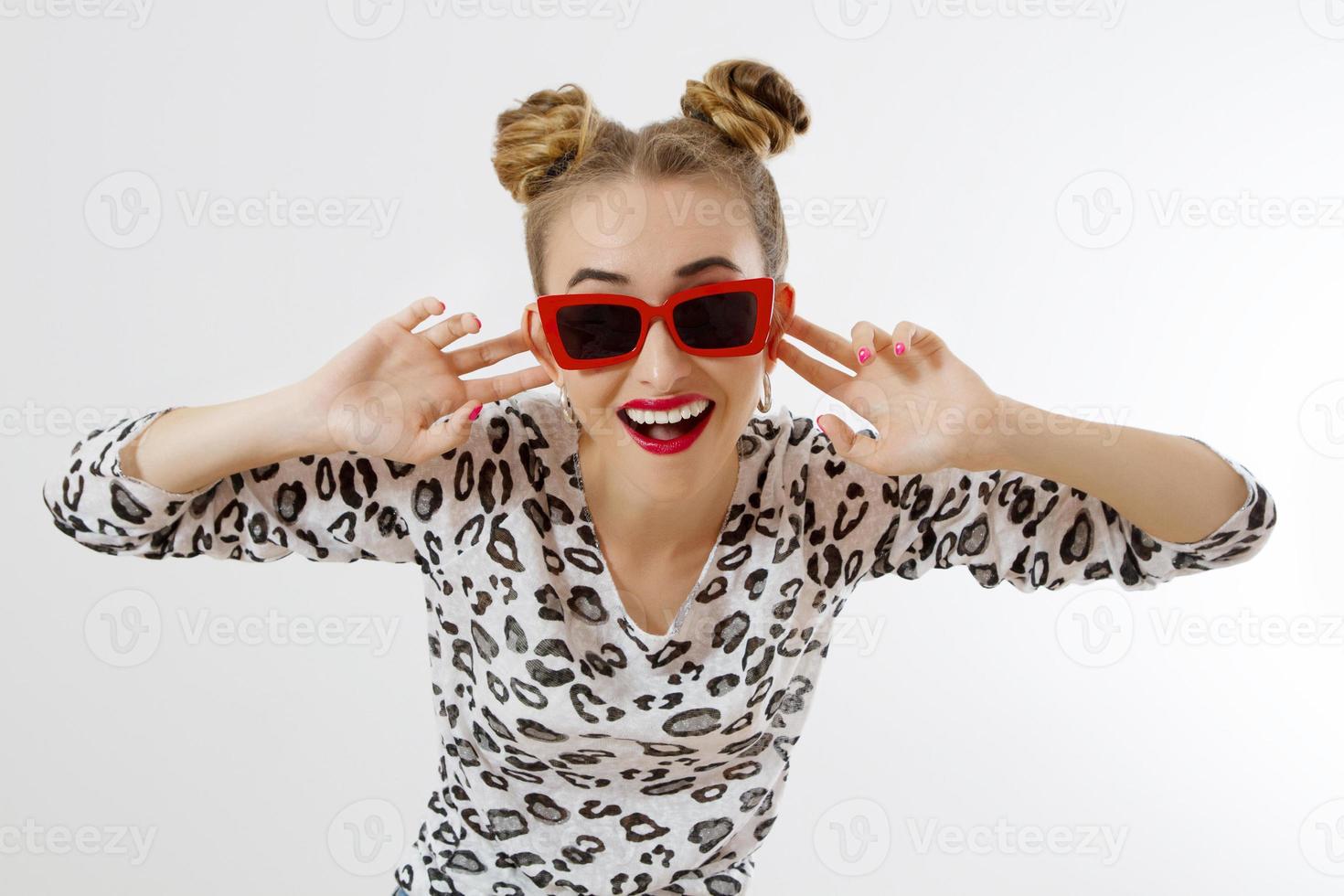 Shouting woman face. Fashion crazy female closeup in trendy clothes isolated on white background. Summer fun time and summertime accessories. Funny girl. photo