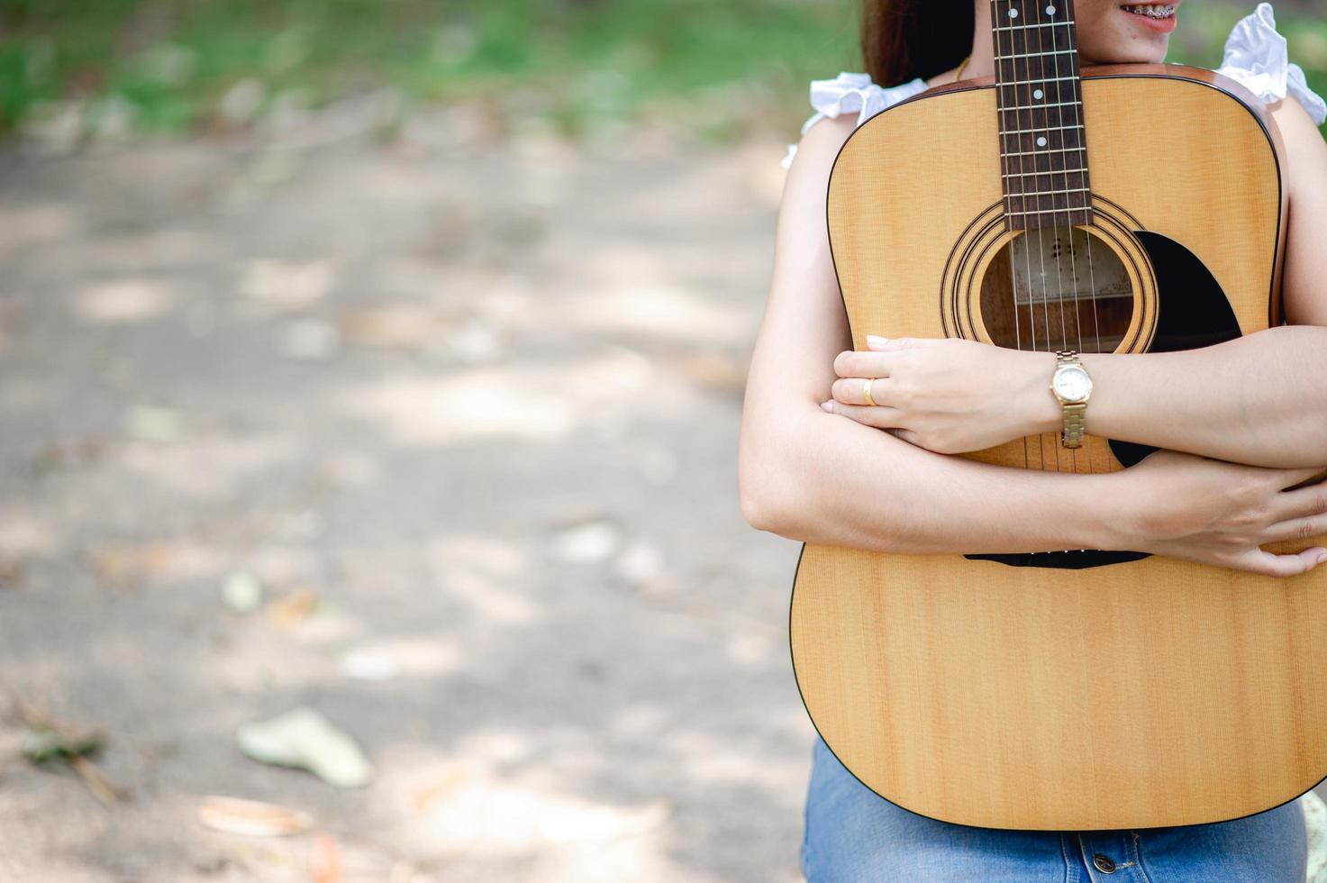 Musician hands and acoustic guitars, musical instruments with very good sound Musical instrument concept photo