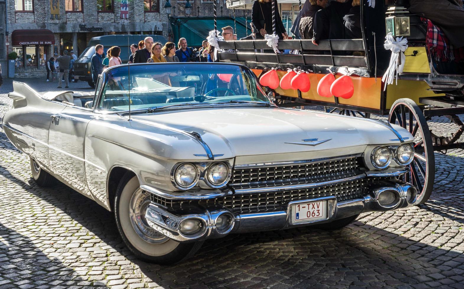 Bruges, Belgium, 2015. Cadillac Wedding Car in the Market Square photo