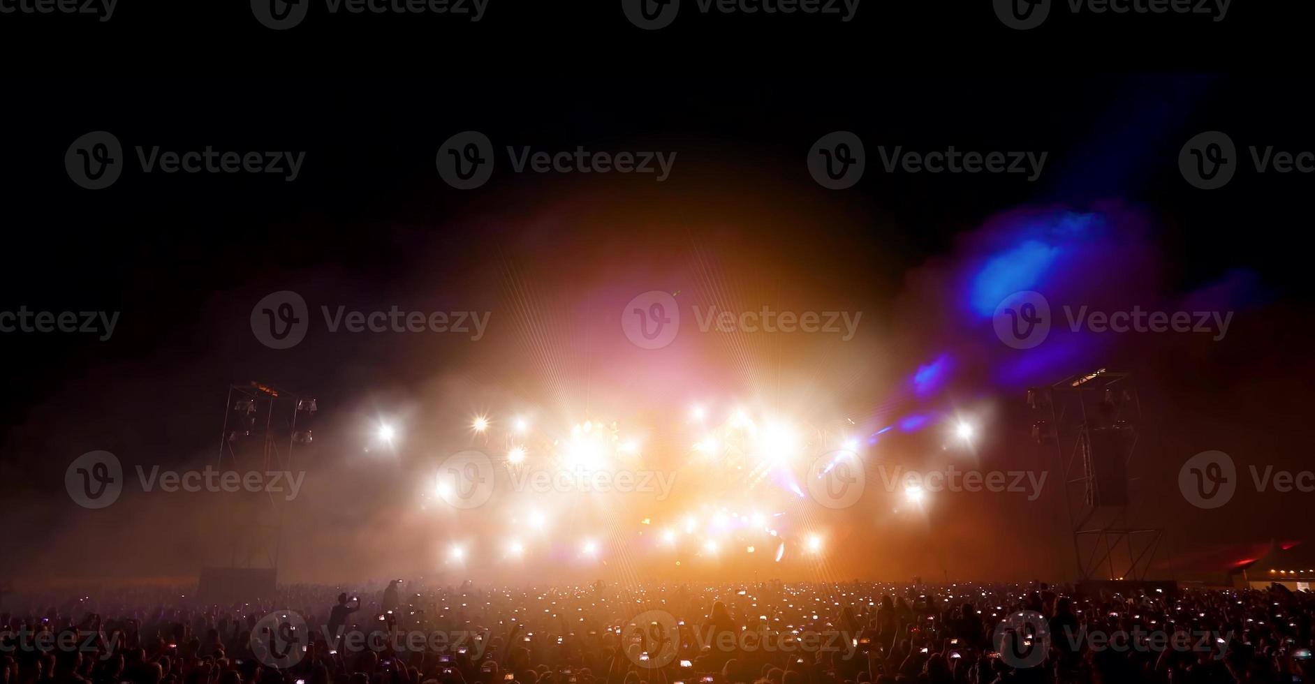 Silhouette concert in front of stage photo