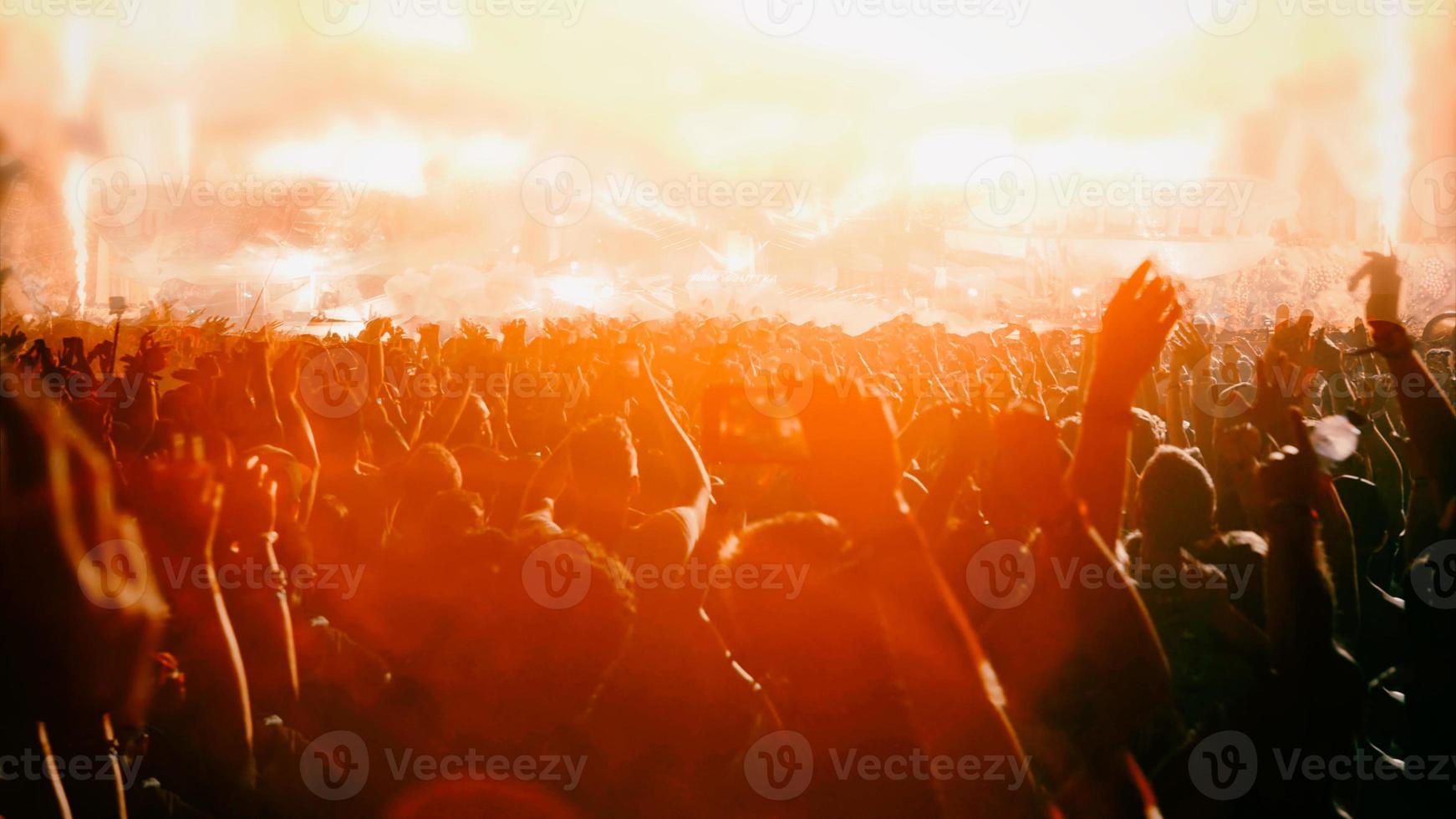 Silhouette concert in front of stage photo