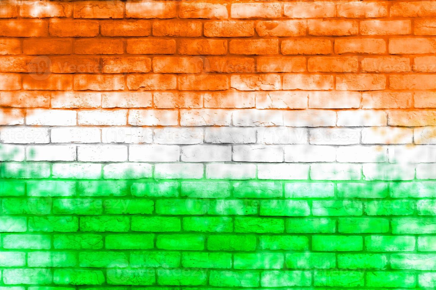Colorful brick wall background. Walls painted with the India flag color. photo