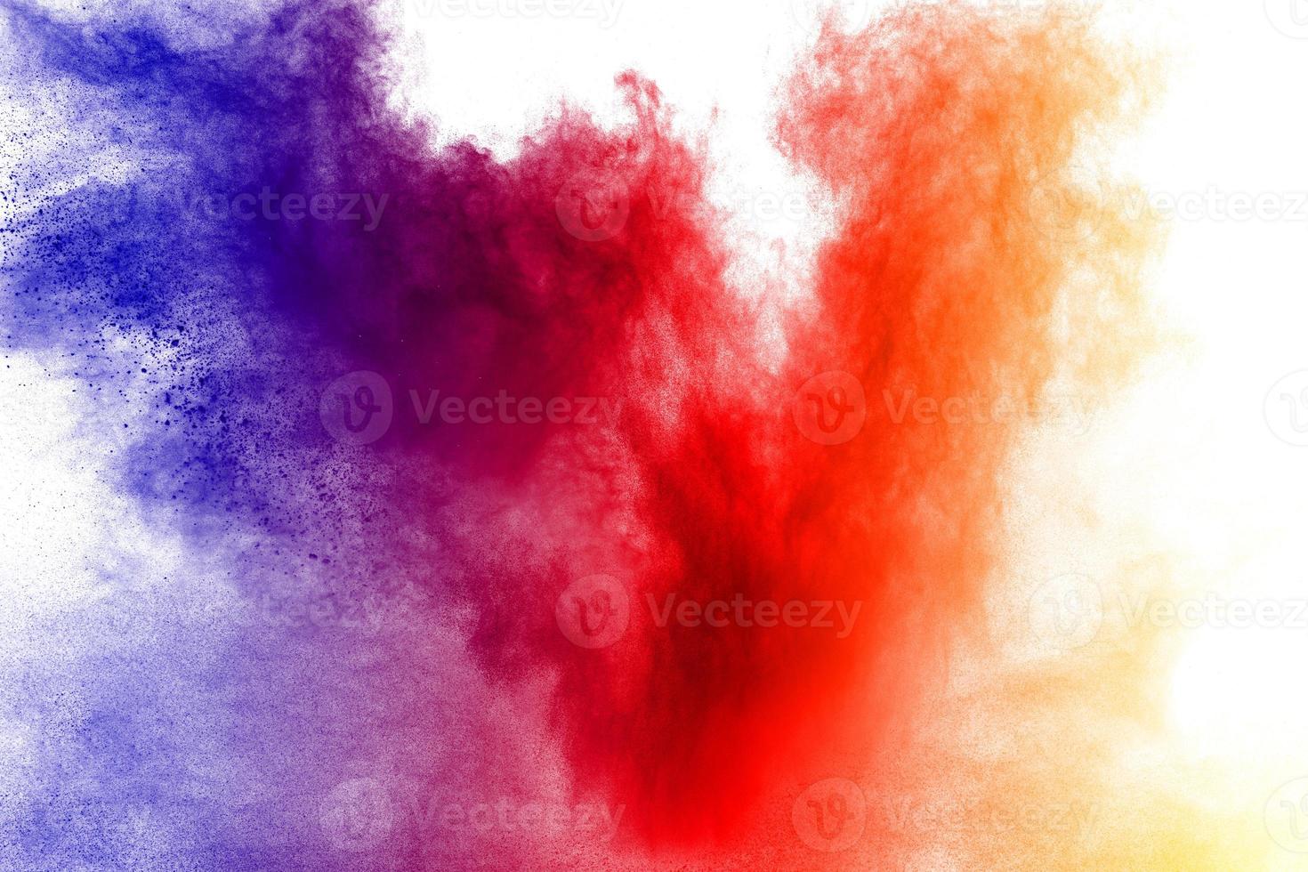 Abstract multi color powder explosion on white background.  Freeze motion of  dust  particles splashing. Painted Holi in festival. photo