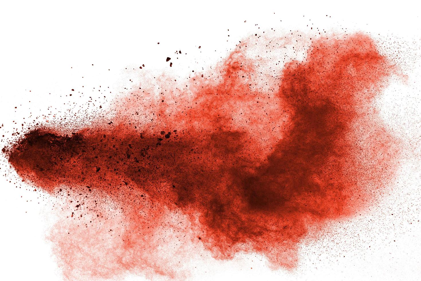 abstract red dust splattered on white background. Red powder explosion. photo