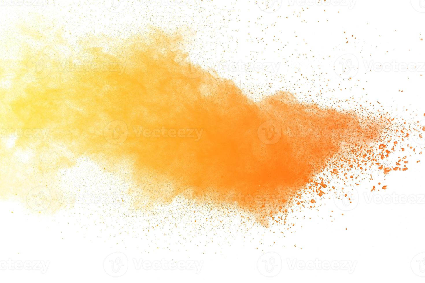 Abstract yellow powder explosion white on  background. Yellow dust particle splashing. photo