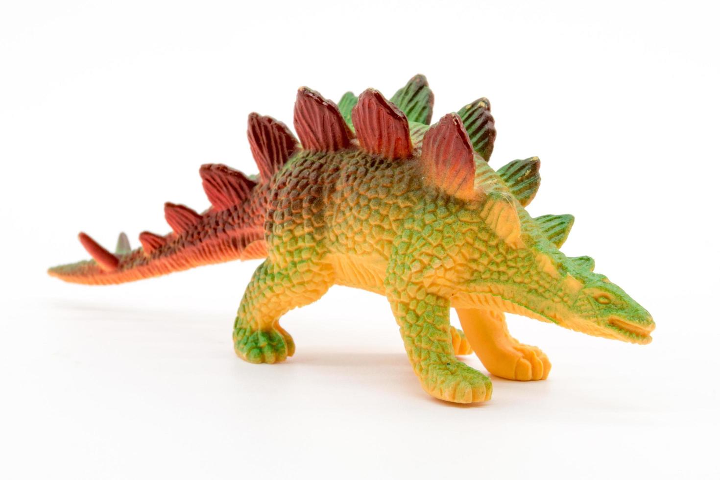 Stegosaurus toy model on white background photo